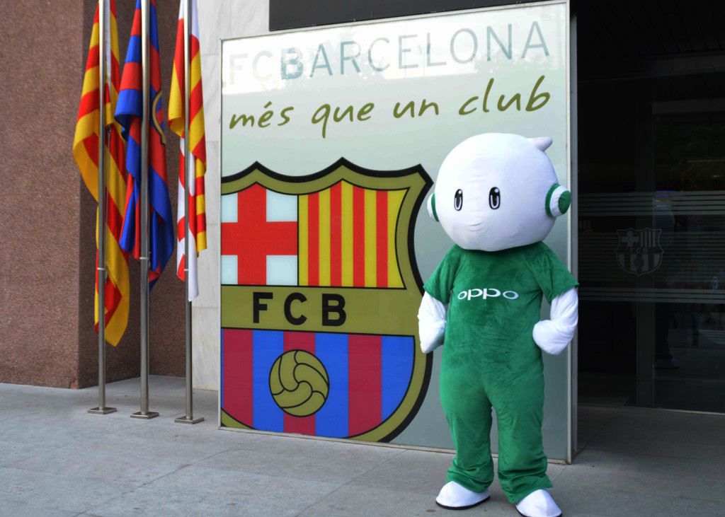 Ollie, the mascot of OPPO, stands alongside the FC Barcelona club