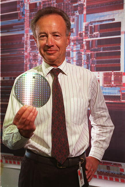 Andrew Grove, CEO of Intel Corporation, holds an Intel 1386 microprocessor at the company plant in Santa Clara, California. The wafer serves as the brains of a personal computer and is worth about $200. It is the most popular product made by Intel. (AP Photo/Paul Sakuma)