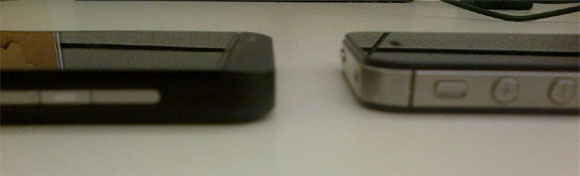 the upcoming blackberry z10 gets torn apart poses next to the iphone-2